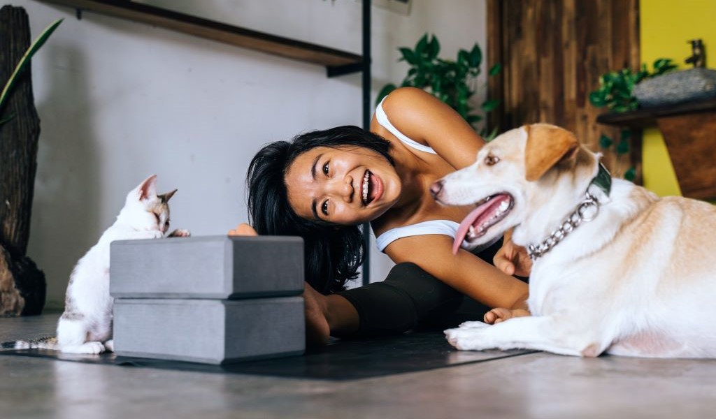 Woman and her pets at home